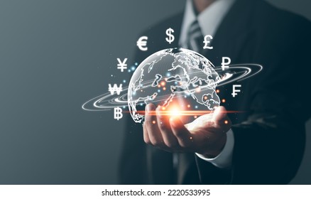 Online banking interbank payment concept. Businessman with virtual global currency symbols in hand. Money transfers and currency exchanges between countries of the world.  - Shutterstock ID 2220533995