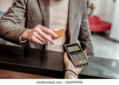 Online Banking. Young Man Wearing Casual Clothes And Going To Pay For Hotel Room