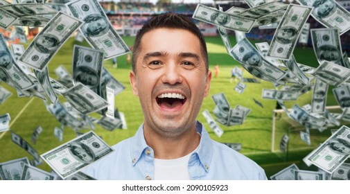 Online Betting, Gambling And Sport Concept - Happy Man Over Money Rain And Football Field Background