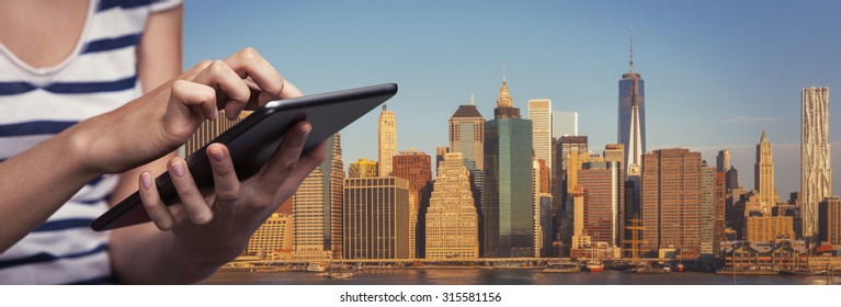 Online Booking. Hotel Reservation Via Internet. Young Woman Uses A Tablet PC For Hotel Reservation