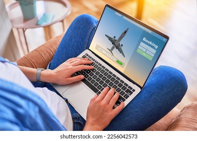 Online booking plane tickets using computer  - Powered by Shutterstock