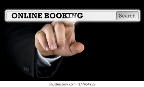 Online booking written in a navigation bar on a virtual interface or computer screen with a businessman reaching out his finger to activate the button from behind.