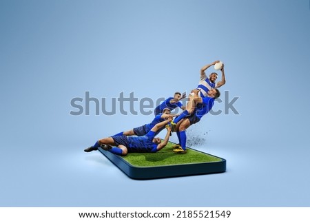 Online broadcasts of sports competitions. Collage with rugby players team in action on 3d gadget screen over blue background. Sport, achievements, media, betting, news, ad