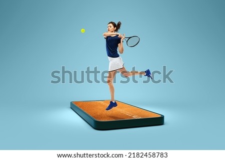 Online broadcasts of sports competitions. Creative collage.Young woman, tennis player in action on 3d phone screen over blue background. Show, games, online events, media, betting, ad