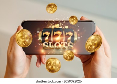 Online casino, smartphone with slot machine with jackpot and gold coins. Online Slots, Lucky Seven 777, Dark Gold Style. Luck concept, gambling, jackpot, banner - Shutterstock ID 2059392026