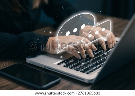 Online communication concept with chat bubbles over laptop, messaging system, customer support, digital interaction, social network, business communication and technology connection.