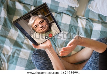 online communication social media elderly woman in an online call