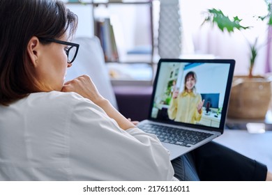 Online consultation, female teacher talking to teenage student - Shutterstock ID 2176116011