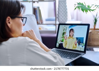 Online consultation, female teacher talking to teenage student - Shutterstock ID 2178777731