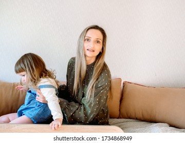 Online Consultation With A Pediatrician. Mom And Baby Girl At The Doctor's Appointment.Doctor Medical Online Call. Doctor Therapist Psychologist Speaks With Couple Video Chat Using A Laptop