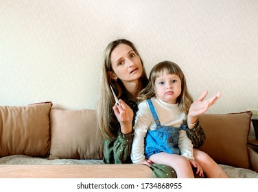 Online Consultation With A Pediatrician. Mom And Baby Girl At The Doctor's Appointment.Doctor Medical Online Call. Doctor Therapist Psychologist Speaks With Couple Video Chat Using A Laptop