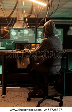 Online criminal programming password cracking script to hack system and cause data breach. Woman committing cybercrime and stealing government information from official database. Cyberterrorism.