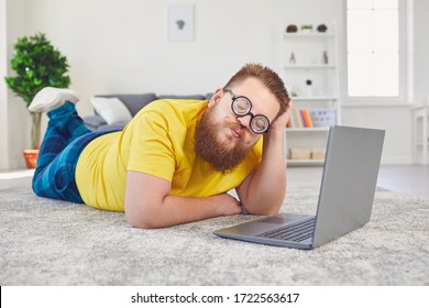 Online dating chat video chat call.Funny fat man in glasses of a fool with a laptop on a date online video call chat application in the room at home. - Powered by Shutterstock