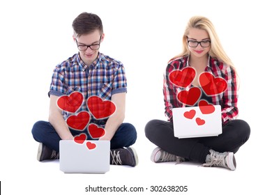 online dating concept - young man and woman sitting with laptops and sending love messages isolated on white background