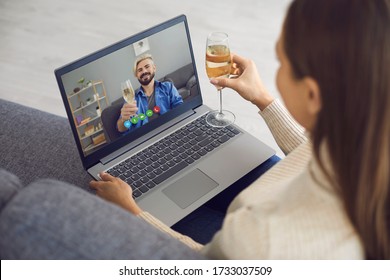 Online Dating. Date Online. Man And Woman With Glasses Of Wine On A Date Using Laptop Video Chat Sitting At Home.