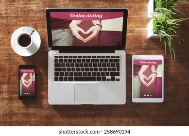 Online dating website on a laptop display, hardwood desktop on background