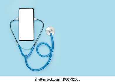 online doctor. app health phone mockup. get an online consultation from doctor by mobile phone. stethoscope and cell phone on blue background. copy space. doctor online consultation concept