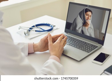 Online Doctor And Patient. A Patient With Flu Symptoms Has A Video Chat Conference Call With Doctors At The Clinic Office.