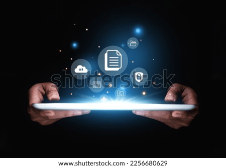 Online document file management, database technology concept, Hand of businessman showing document management icon on tablet.