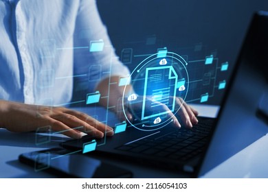 Online documentation database and document management system concept.	
Businesswoman working on laptop with virtual screen. Process automation to efficiently manage files.  - Shutterstock ID 2116054103