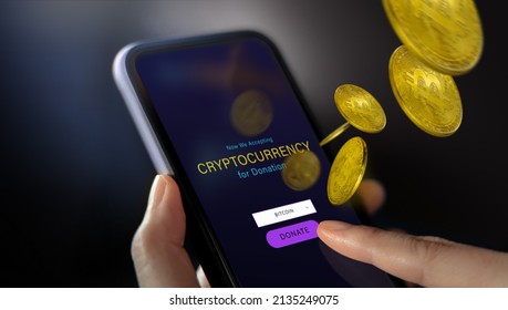 Online Donation by Cryptocurrency Concept. Closeup of Hand Using a Mobile Phone to making Donate Bitcoin via the Internet - Powered by Shutterstock