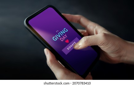 Online Donation, Charity and Volunteering Concept. Closeup of Hand Using a Mobile Phone to making Donate via the Internet - Shutterstock ID 2070783410