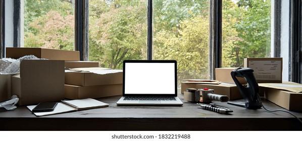 Online Ecommerce Store Mockup, Dropshipping Business Website Concept. Table With Laptop Computer Mock Up Blank White Screen And Shipping Boxes, Retail Marketplace, Warehouse Delivery Background.