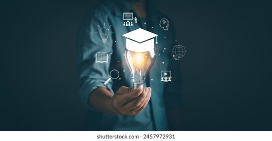 Online education course or e-learning technology Concept.Man holding light bulb on virtual screen Training, Internet on education, study of knowledge for creative thinking idea and problem solving. - Powered by Shutterstock