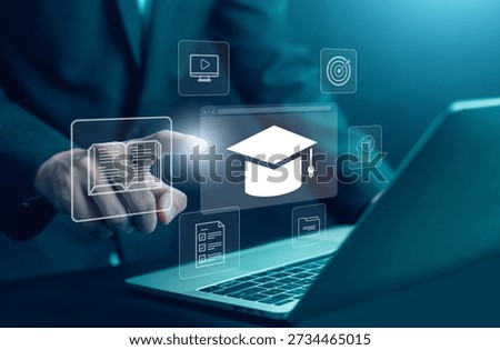 Online education and e-learning concept with virtual graduation cap and digital learning icons on transparent interface. Businessman using laptop for training, knowledge, modern education technology.