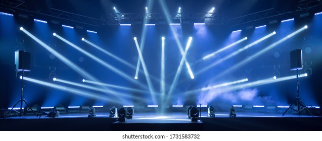 Online event entertainment concept. Background for online concert. Blue stage spotlights. Empty stage with blue spotlights. Blue stage lights. Online COVID-19 concert. Live streaming concert - Shutterstock ID 1731583732