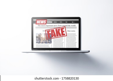 Online Fake News On A Laptop Screen. Mockup Website. Newspaper And Portal On Internet. Concept Of Disinformation And Propaganda