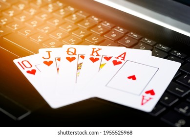 Online Gaming Platform, Casino And Gambling Business. Poker Cards On Laptop Keyboard