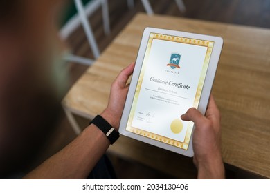 Online Graduate Certificate. Successful Man Receiving His College Diploma In The Tablet 