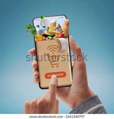 Online grocery shopping app: customer holding a smartphone and ordering groceries online