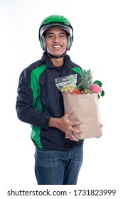 Online Grocery Store. Online Driver Courier Carrying Groceries. Uber Rider Delivery Service Isolated Over White Background