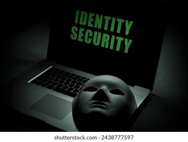 Online Identity Security concept - Laptop computer with mask to hide identity