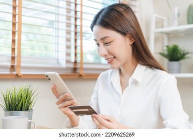 Online Internet Banking, Asian Young Woman Hand In Payment Spending By Scan Qr Code, Use Phone, Mobile To Transfer Money Or Pay Money Of Credit Card Without Cash At Home. Technology Of Financial.