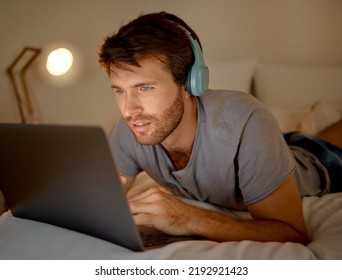 Online, Laptop And Late Night Stream Or Work In The Bedroom. Man Using Internet On Pc To Watch Series, Esports Or Gaming To Relax. Stress Management And Entertainment With Online Technology At Home.