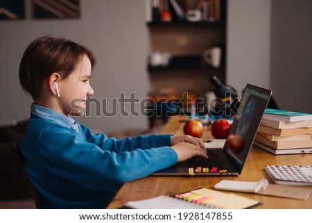 Online learning, boy using laptop for his classes