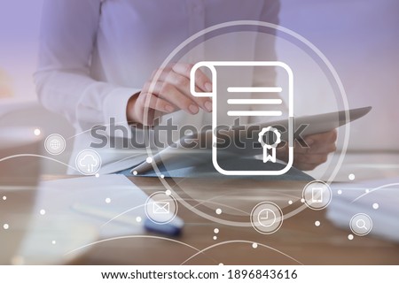 Online learning concept. Diploma with other icons on foreground and woman using tablet, closeup