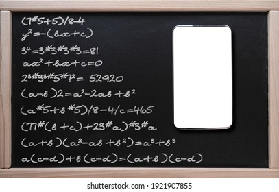 . Online learning, math classes. Tablet on the background of a class board with written mathematical formulas