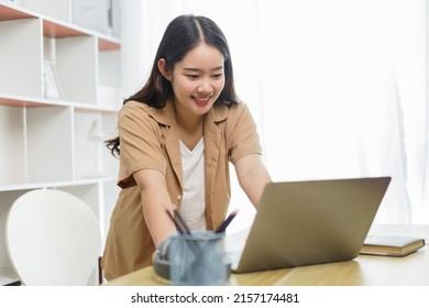 Online Lifestyle Concept A Working Woman Being Eager To Type Her New Project’s Idea On Her Notebook