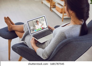 Online Medical Consultation..A Sick Young Woman Video Chat With A Male Doctor Sitting At Home.