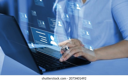 Online and modern technologies for simplifying the human resources system.Human resource manager checks the CV online to choose the perfect employee for his business.HR(human resources) technology. - Shutterstock ID 2073401492