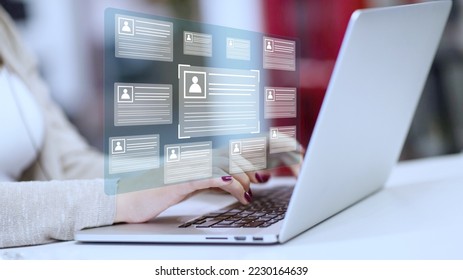 Online and modern technologies for simplifying the human resources system.Human resource manager checks the CV online to choose the perfect employee for his business.HR(human resources) technology. - Shutterstock ID 2230164639