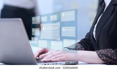 Online and modern technologies for simplifying the human resources system.Human resource manager checks the CV online to choose the perfect employee for his business.HR(human resources) technology. - Shutterstock ID 2230164645