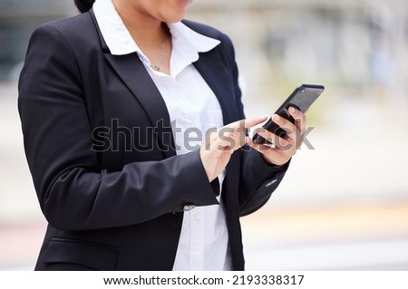 Online, networking business woman in a suit and smartphone reading email communication, WhatsApp or mobile project management app on the go. Corporate professional hands typing on smartphone in city