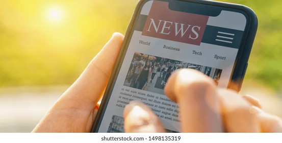 Online News On Mobile Phone. Close Up Of Smartphone Screen. Woman Reading Articles In Application. Hand Holding Smart Device. Mockup Website. Newspaper And Portal On Internet.