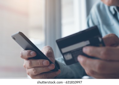 Online Payment Or Internet Banking,  Man Makes An Online Shopping By Credit Card Payment On Mobile Smart Phone, Online Banking, E Commerce, E Business, Internet Of Things Concept