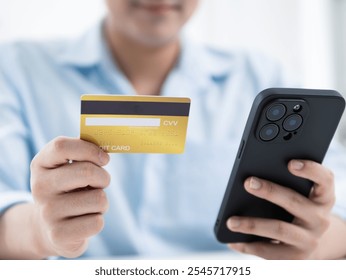 Online payment process man using smartphone to make transaction with credit card modern office digital finance concept - Powered by Shutterstock - Get 15% off with code: PIKWIZARD15
